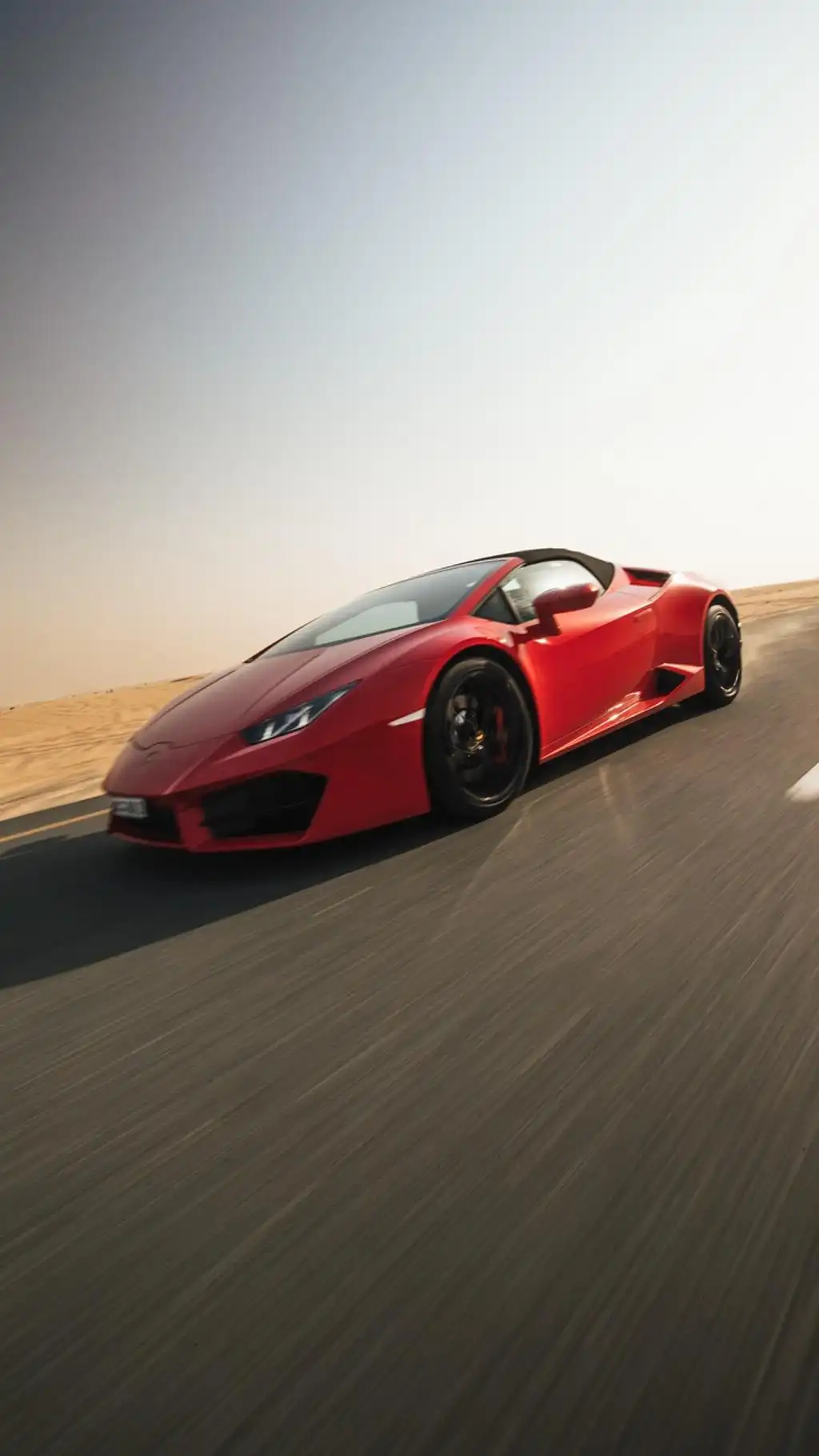 Red Supercar Speeding on Highway